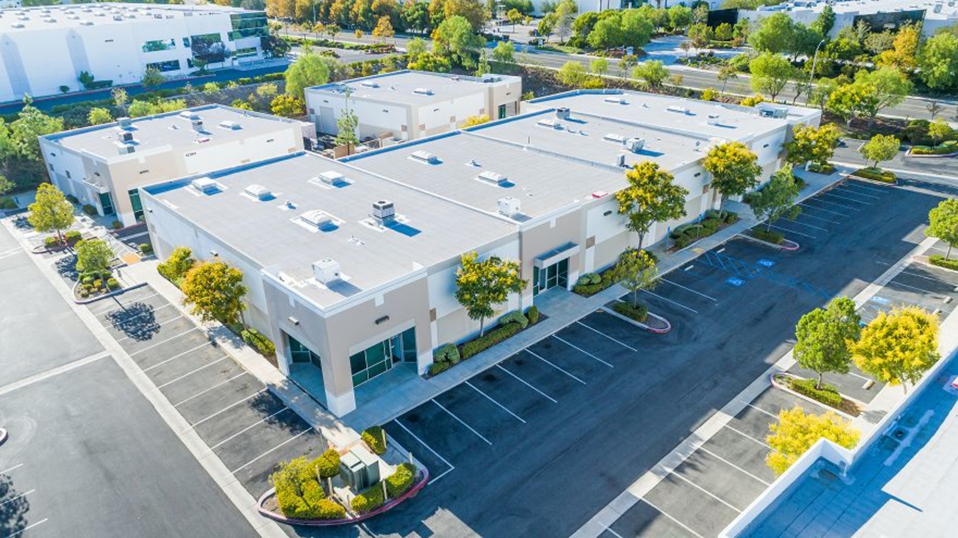Aerial view of a completed roof on a commercial building.
