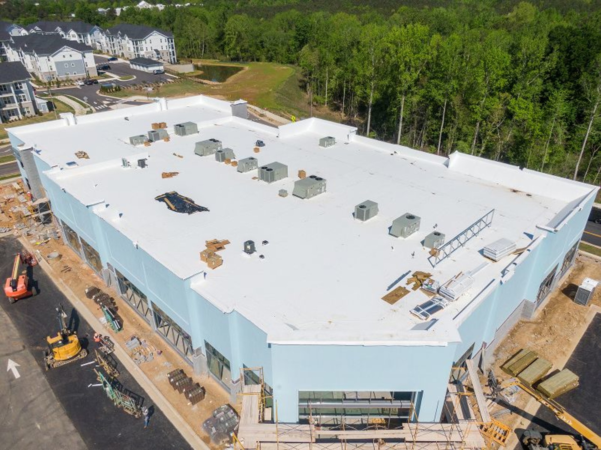Aerial view of a roof on a commercial building under construction.
